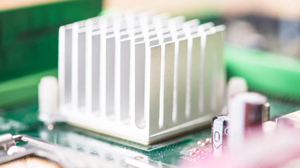 Macro shot white heatsink motherboard circuit